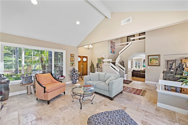 living room with a chandelier, beamed ceiling, and high vaulted ceiling