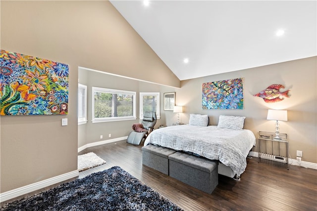 bedroom with high vaulted ceiling and dark hardwood / wood-style floors