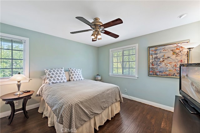 bedroom featuring ceiling fan and dark hardwood / wood-style floors