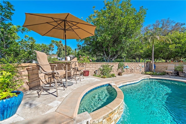 view of swimming pool featuring a patio