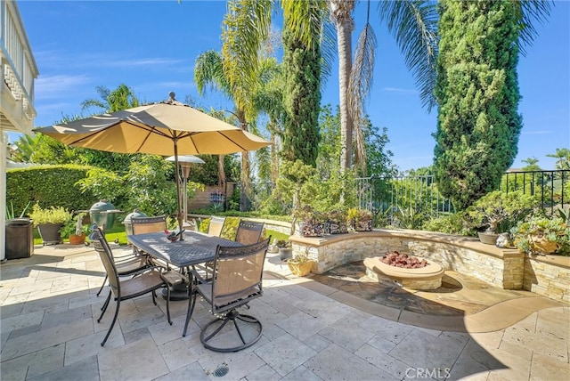 view of patio / terrace featuring a fire pit