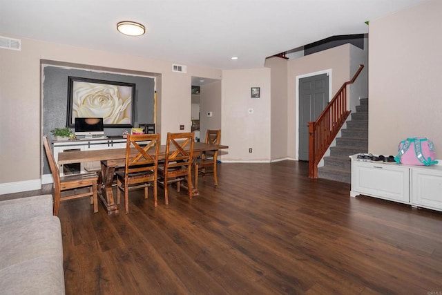 dining area with dark hardwood / wood-style flooring