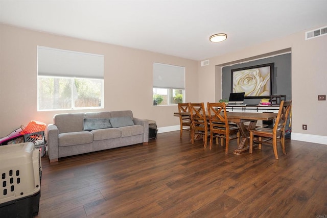 dining space with dark hardwood / wood-style floors