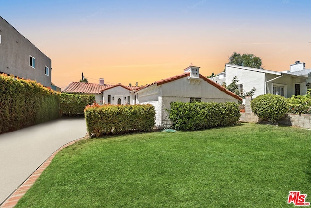 view of front of house with a lawn