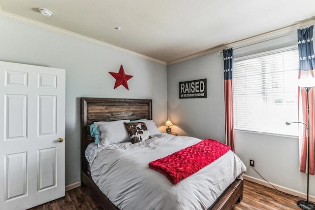 bedroom with dark wood-type flooring, ornamental molding, and multiple windows