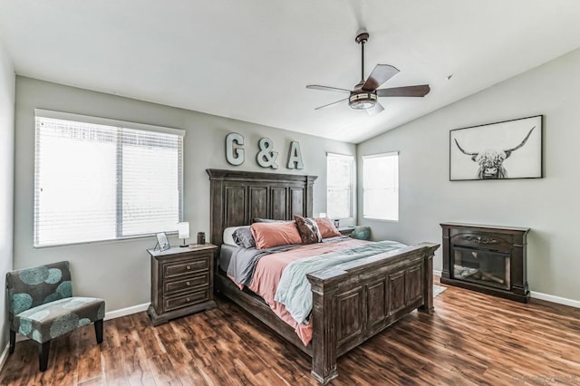 bedroom featuring vaulted ceiling, ceiling fan, and dark hardwood / wood-style floors