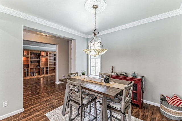 dining space featuring dark wood-type flooring, built in features, and crown molding