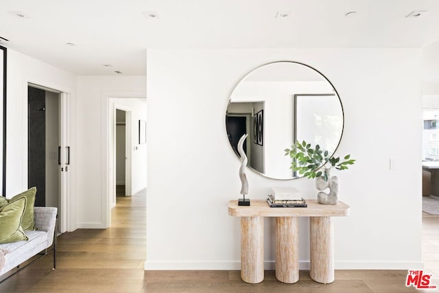 hall with light hardwood / wood-style floors