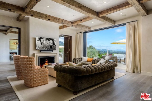 living room with beamed ceiling, coffered ceiling, and hardwood / wood-style flooring