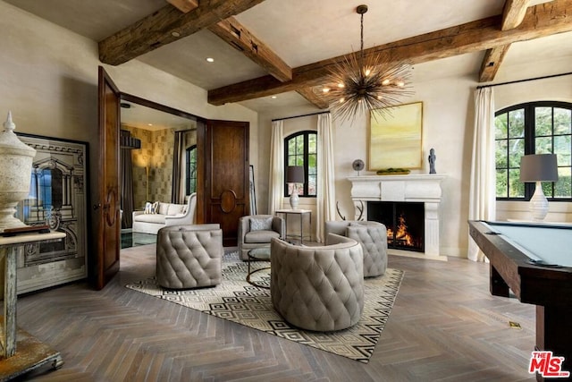 living room with beam ceiling, pool table, and parquet flooring