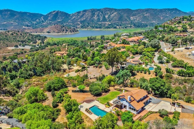 bird's eye view with a water and mountain view