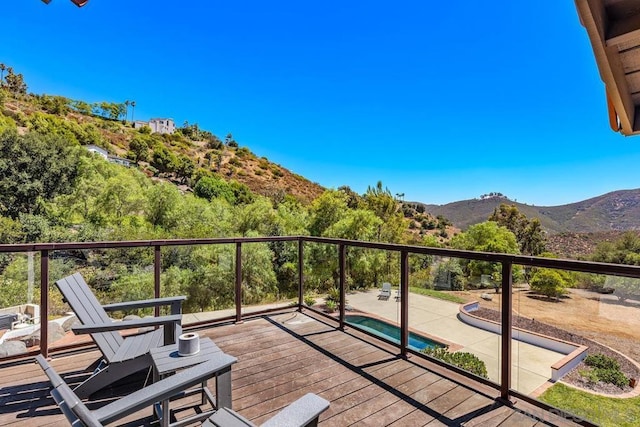 balcony featuring a deck with mountain view