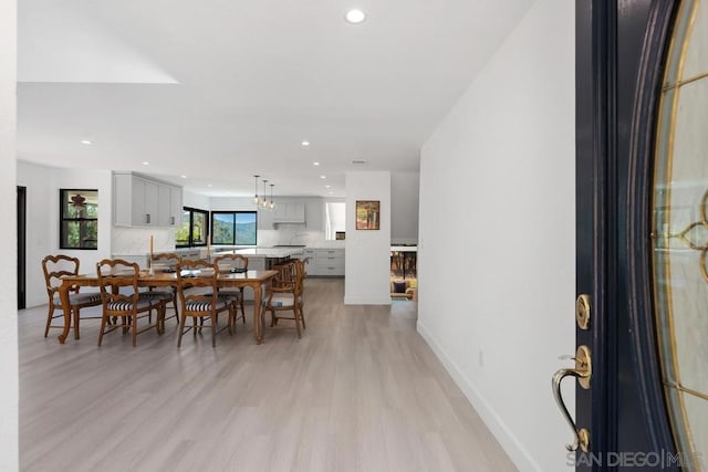 dining area with light hardwood / wood-style floors