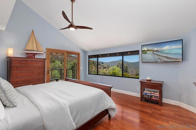 bedroom with vaulted ceiling, ceiling fan, and hardwood / wood-style floors