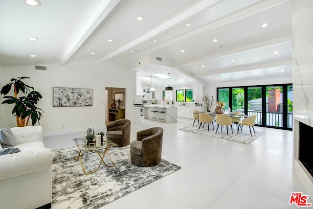 living room featuring lofted ceiling with beams