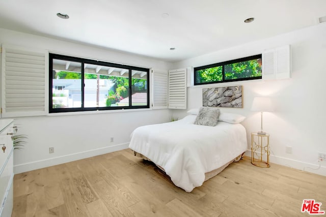 bedroom with light hardwood / wood-style flooring