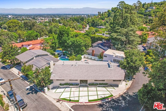 birds eye view of property with a mountain view