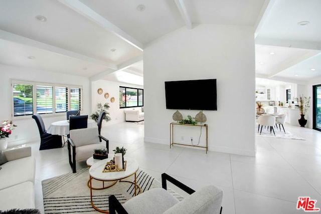 living room with light tile patterned flooring and lofted ceiling with beams