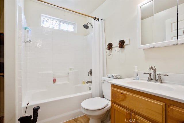 full bathroom with shower / tub combo with curtain, toilet, hardwood / wood-style floors, and vanity