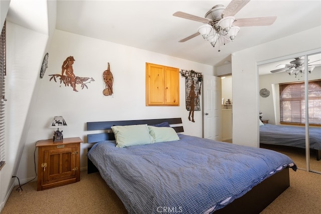 bedroom featuring ceiling fan, a closet, and light carpet