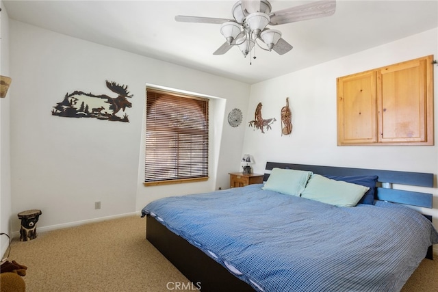 bedroom featuring ceiling fan and light colored carpet