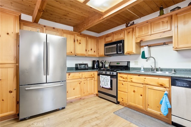 kitchen with appliances with stainless steel finishes, wood ceiling, light hardwood / wood-style flooring, and beam ceiling