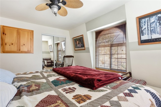 bedroom featuring ceiling fan and a closet