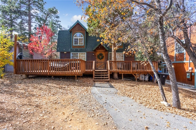 back of property featuring a wooden deck