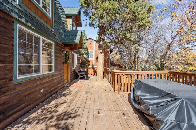 wooden terrace featuring grilling area