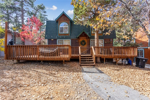 back of property featuring a deck