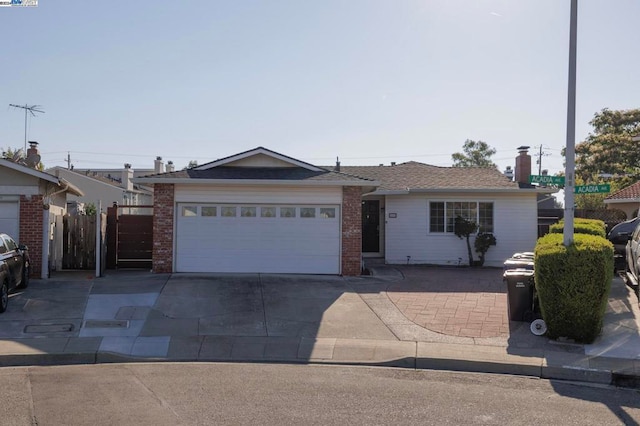 ranch-style house featuring a garage