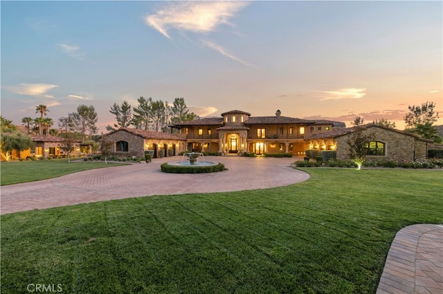 view of front of home with a yard