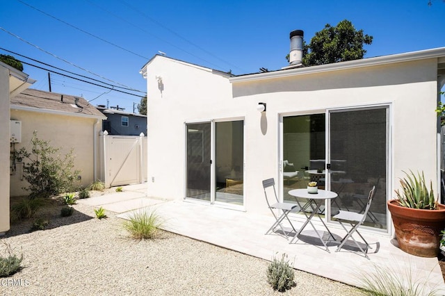 back of house featuring a patio