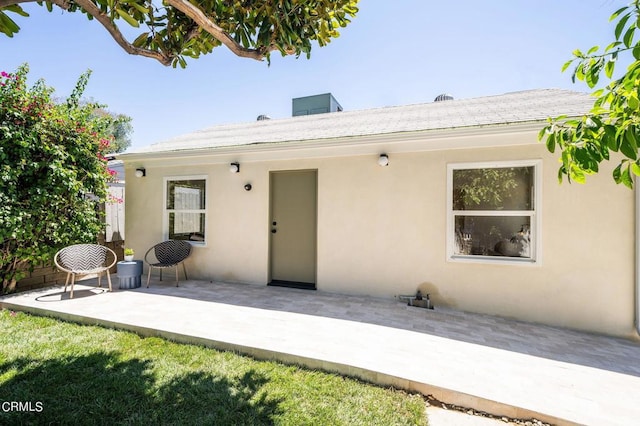 rear view of house featuring a patio area