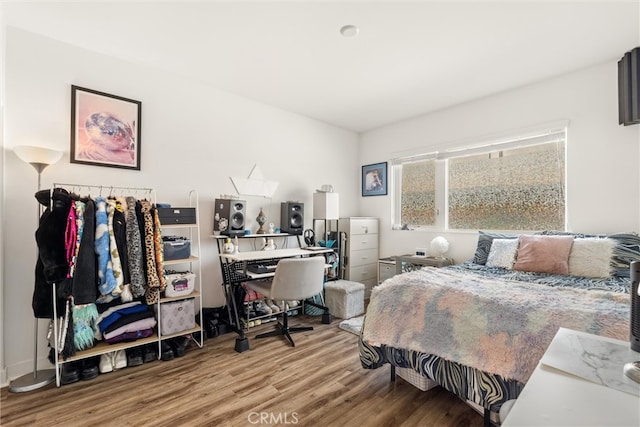 bedroom with wood-type flooring