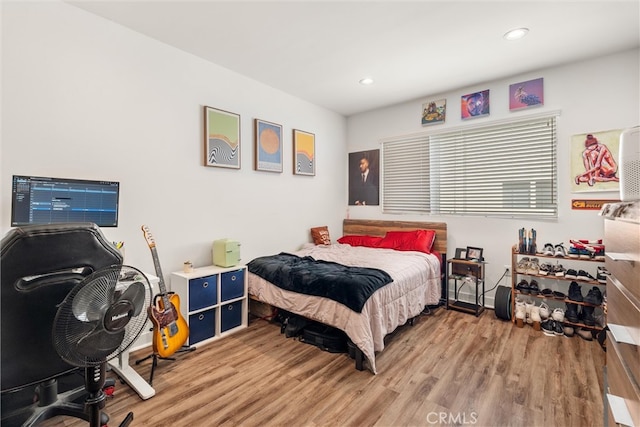 bedroom with wood-type flooring