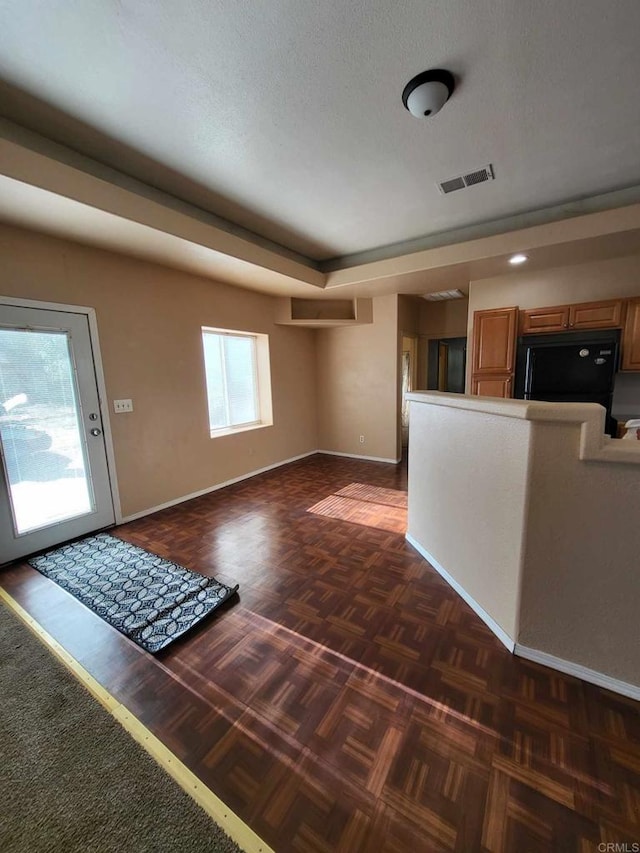 foyer featuring a textured ceiling