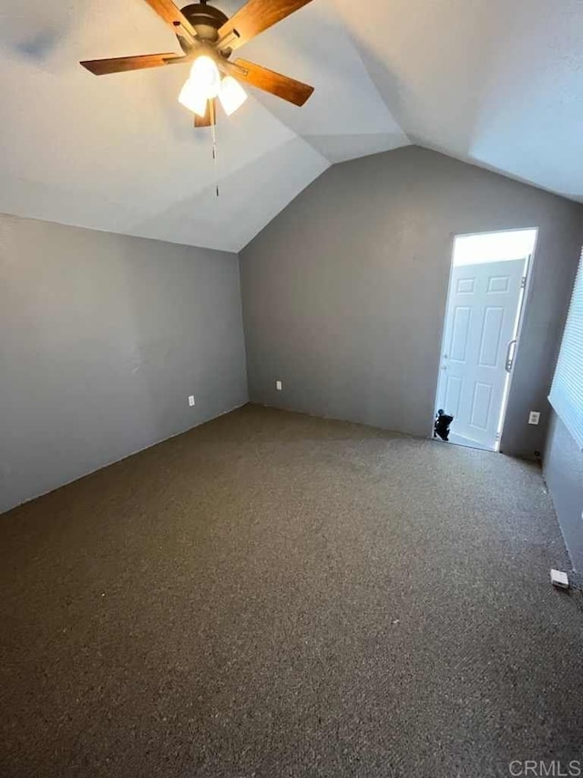 additional living space with carpet floors, vaulted ceiling, and ceiling fan