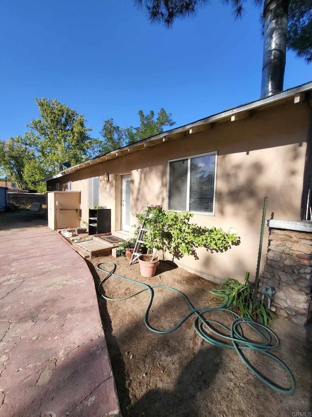 back of house with a patio