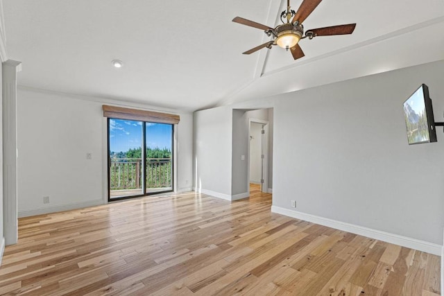 spare room with vaulted ceiling, ceiling fan, and light hardwood / wood-style flooring