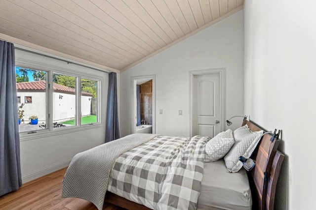 bedroom with lofted ceiling, wood ceiling, and light wood-type flooring