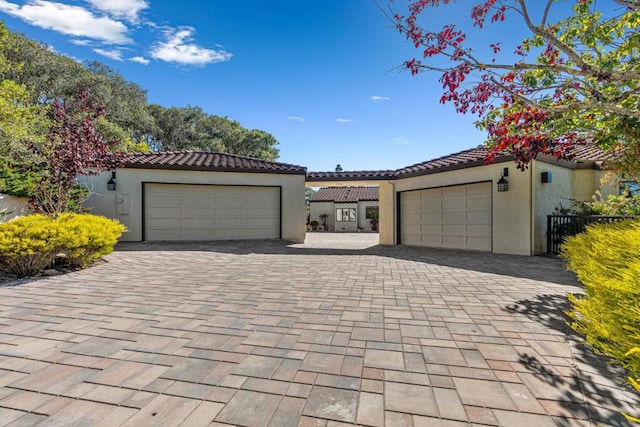 mediterranean / spanish-style home featuring a garage