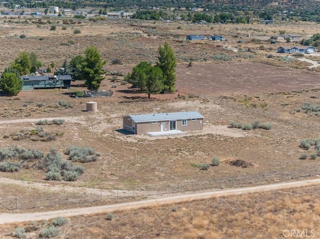 birds eye view of property with a rural view