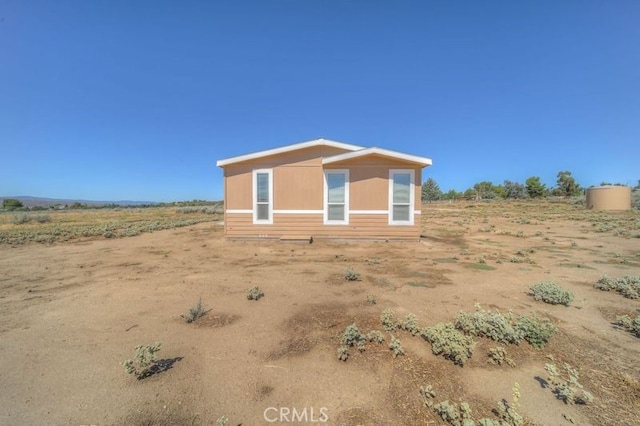 view of outbuilding with a rural view