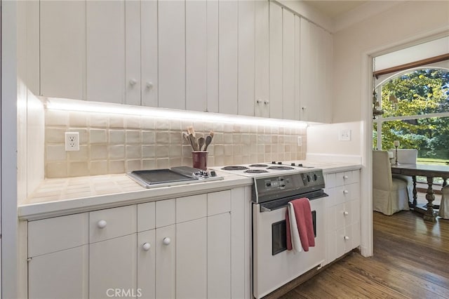 kitchen with dark hardwood / wood-style floors, white cabinetry, backsplash, and white electric range oven