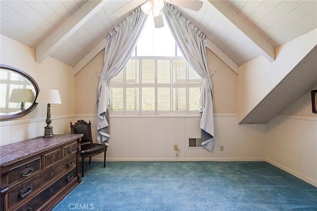 interior space featuring ceiling fan, carpet flooring, and vaulted ceiling with beams