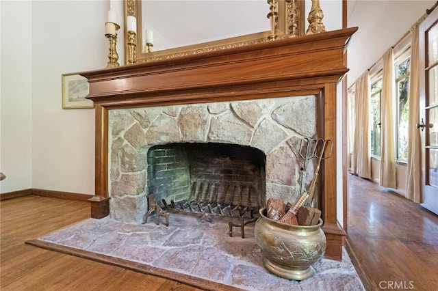 room details featuring a fireplace and hardwood / wood-style floors