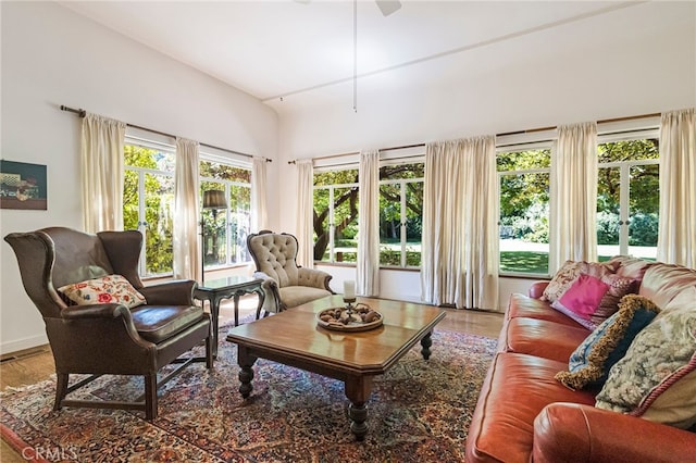 sunroom featuring ceiling fan and french doors