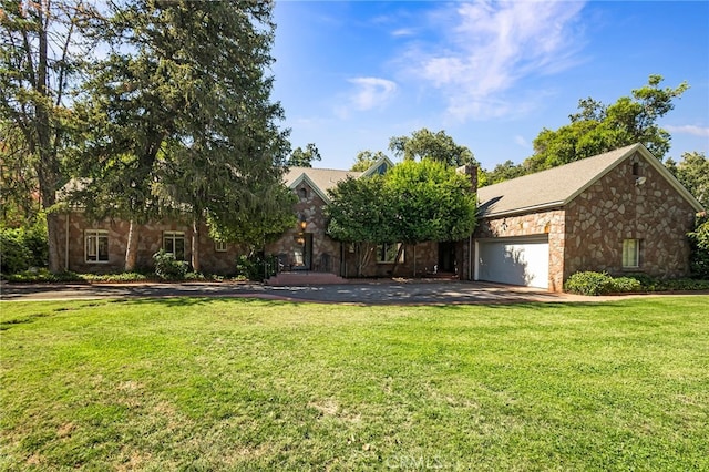 obstructed view of property with a garage and a front yard