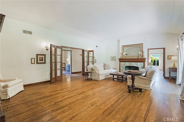 living room featuring french doors and wood-type flooring